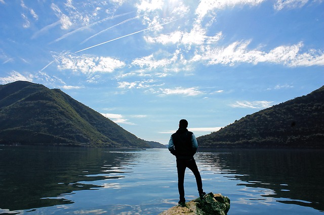 Man thinking while looking out at the lake